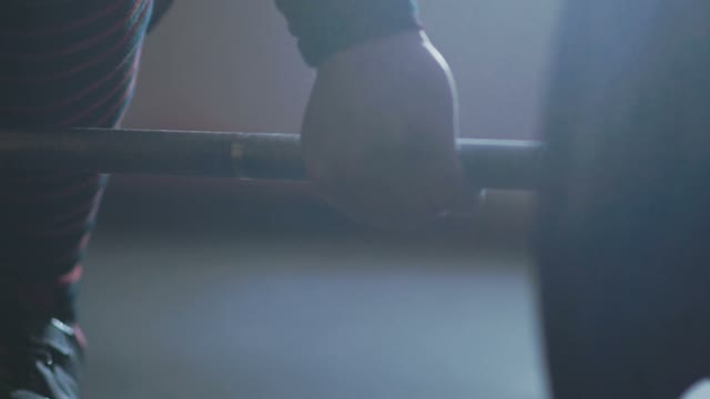 Athlete Takes His Hands On The Barbell