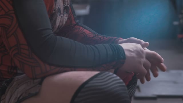 Athlete Sits And Kneads His Fingers