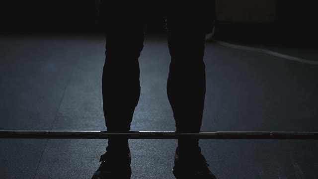 Athlete Preparing To Raise The Barbell