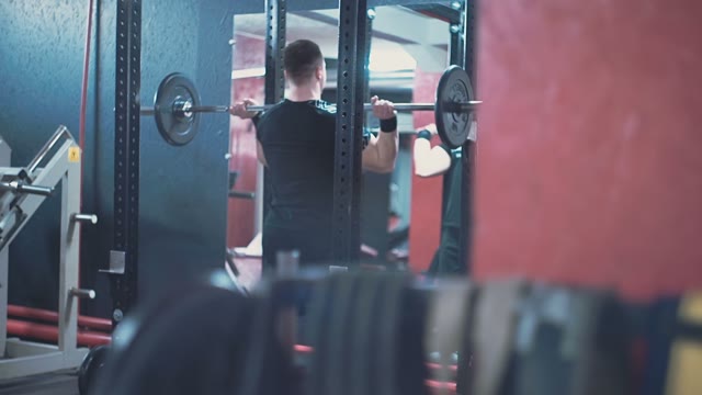 Man Lifts Barbell