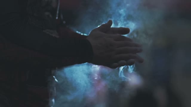 Man Rubs His Palms Against Each Other