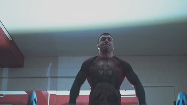 Athlete Holds Barbell