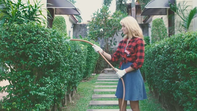 Girl Is Taking Care Of The Garden