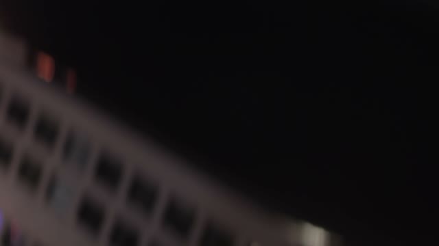 Man In A Cap At Night Close-up