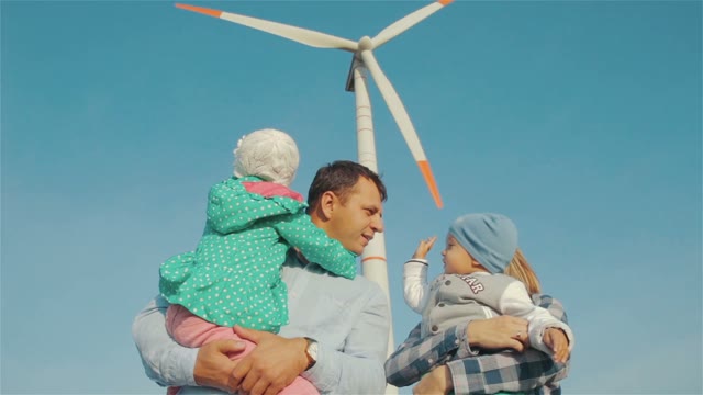 Happy Family With Two Children Playing On Nature