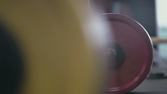 On The Floor In The Gym Lies Barbell