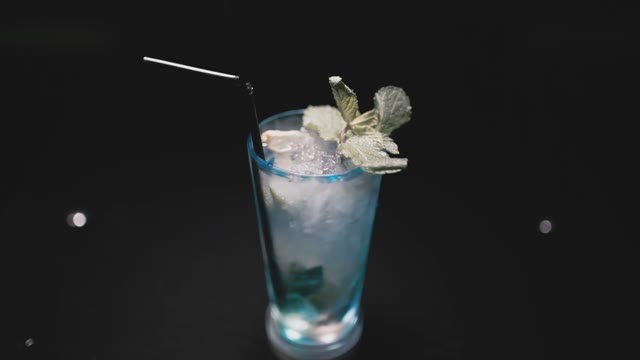 On The Table Is A Turquoise Cocktail