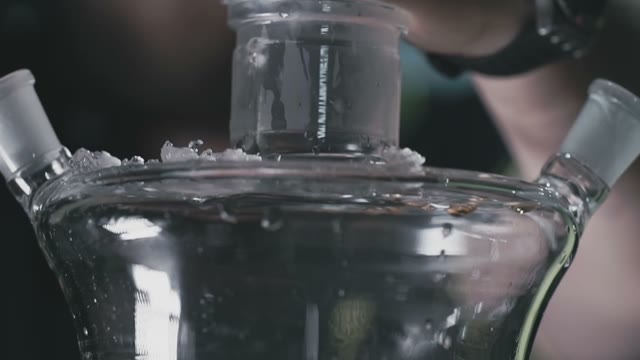 Man Throws Ice Into A Shisha Flask
