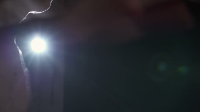 Dancer Turns In Place In The Light Of The Lamp