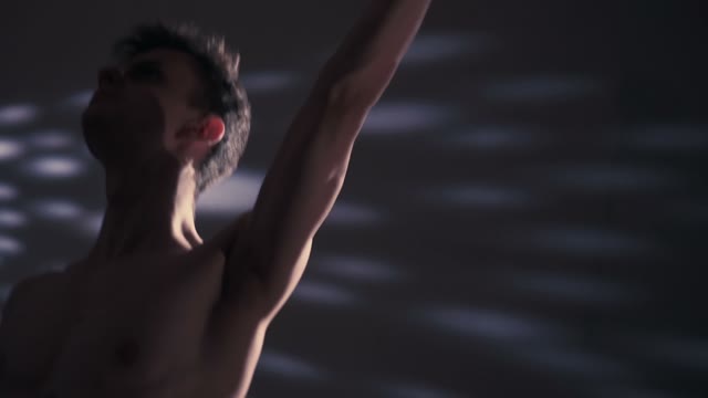 Dancer Moves His Hand In The Dark