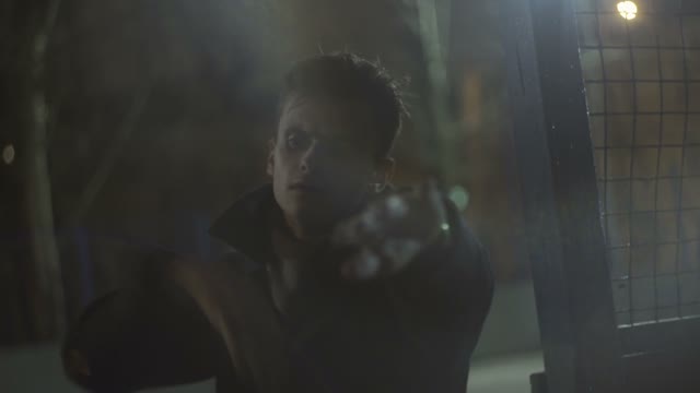 Young Guy In A Coat Dances