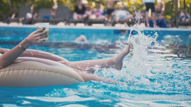 Girl Bathes In The Pool In An Inflatable Circle
