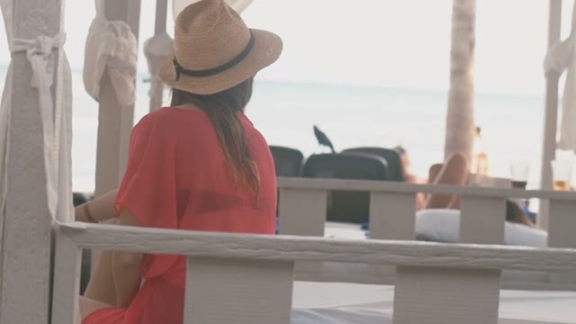 Girl Sits In A Gazebo And Looks At The Sea