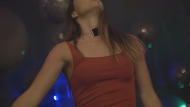 Girl In A Red Dress Is Dancing At A Party Close Up