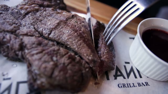 Man Cuts Steak
