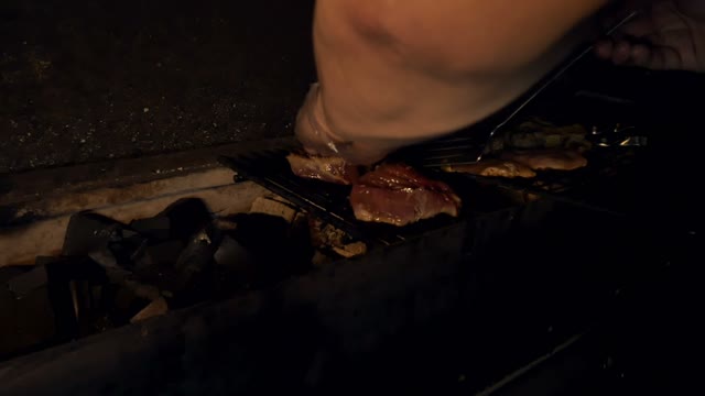 Man Puts Meat Grate