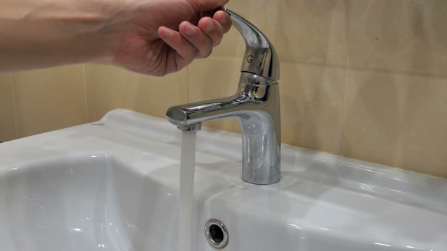 Man Opens Tap Water