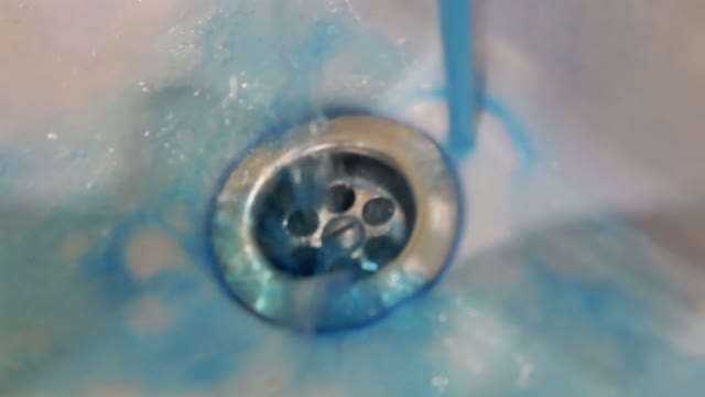 Soapy Water Flows Into The Sink