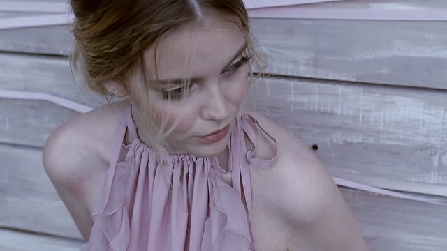 Girl Looks Away And Closes Her Eyes