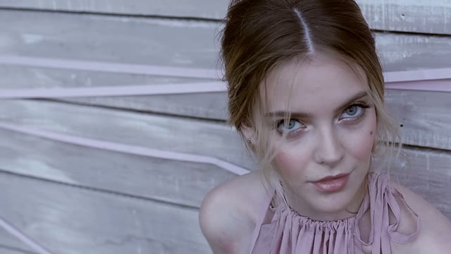 Girl Looks Into The Camera And Closes Her Eyes