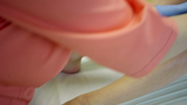 Shugaring Master Rubs The Cream On The Client's Feet