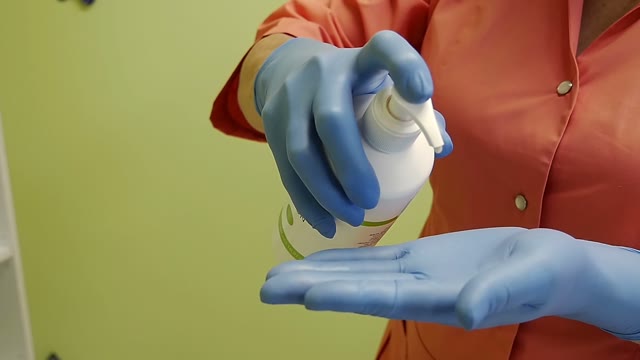 Woman Unsuccessfully Squeezes Out A Cream From A Tube