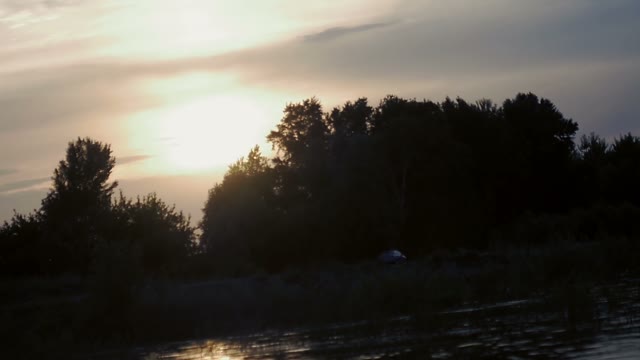 Sunset On The River Bank