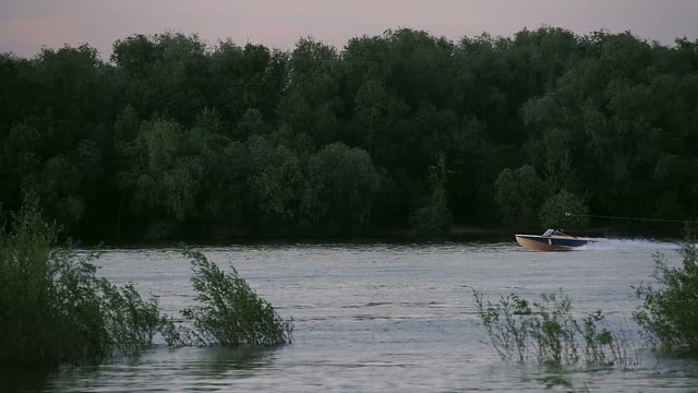 Motor Boat Is Riding To Person On A Water Skiing