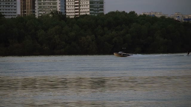 Motor Boat Rides A Person On The Water