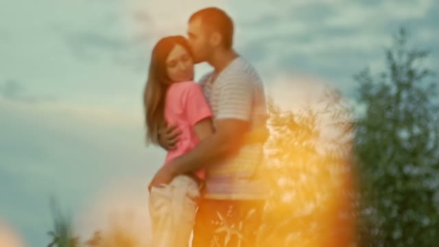 Guy Hugs The Girl And Kisses Her