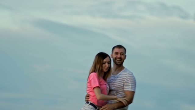 Young Couple Is Standing And Laughing