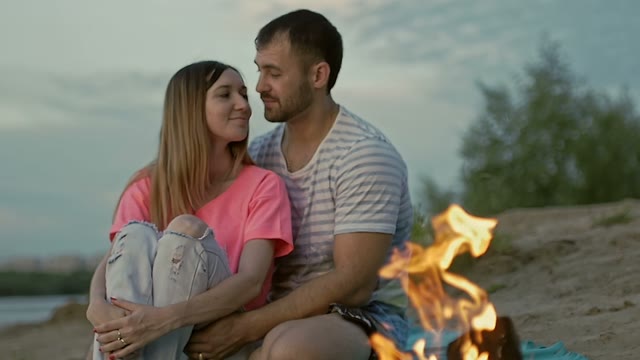 Girl Cuddles Up To The Guy