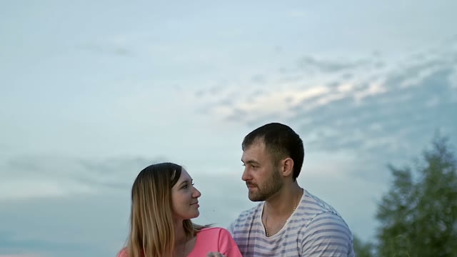 Girl Looks At The Guy And Smiles