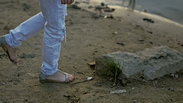 Girl Approaches The Guy And Stands On The Stone