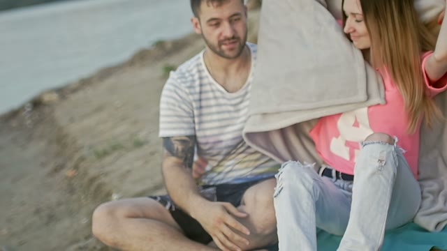 Girl Covers The Man With A Blanket
