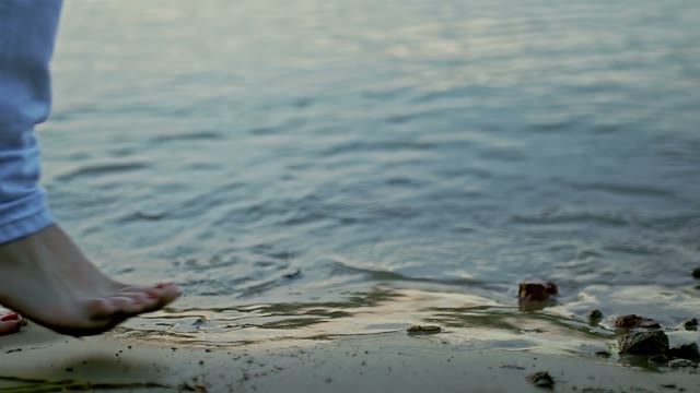 Girl Follows The Guy On The Sandy Coast