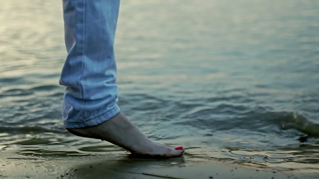 Girl Steps On The Sand