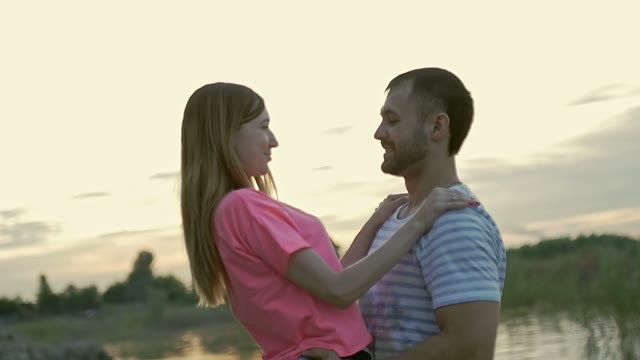 Young Couple Looks In Each Other Eyes