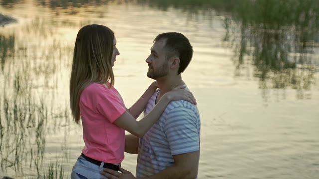 Guy With The Girl Stand And Looking At Each Other