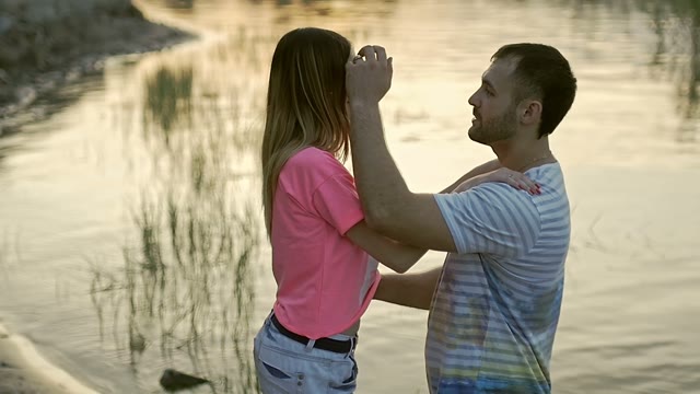 Guy Straightens The Girl's Hair