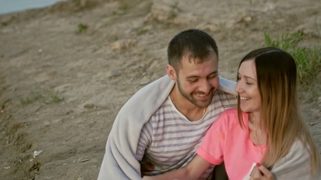 Guy With The Girl Sit And Laugh