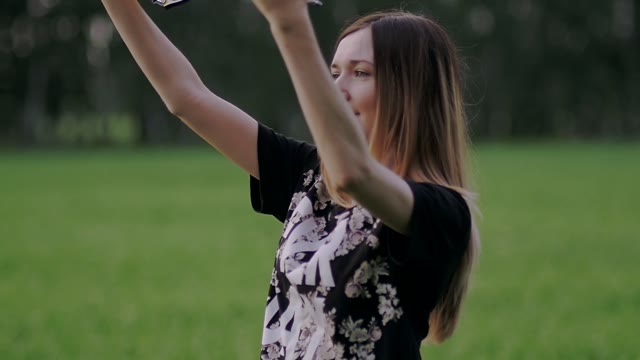 Girl Carries A Kite In Her Hands