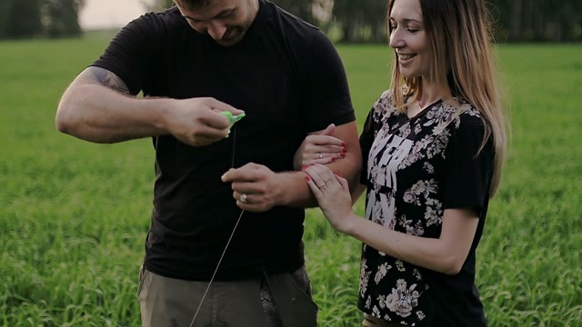 Guy Holding A Thread From A Kite In His Hands