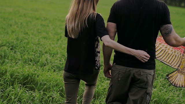 Girl Hugs The Guy Around The Waist And They Go Ahead