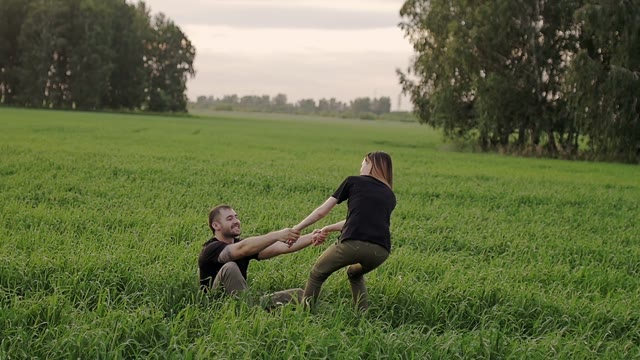 Girl Helps The Guy To Get To His Feet