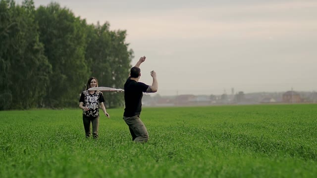 Girl Lets Go Of A Kite And Man Runs With Him In Her Arms