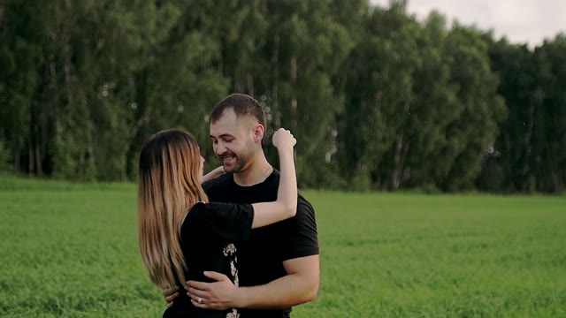 Girl With A Guy Is Standing And Hugging