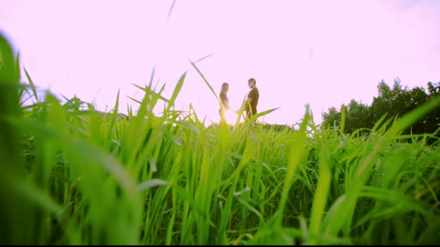 Guy With A Girl Stand And Hold Hands