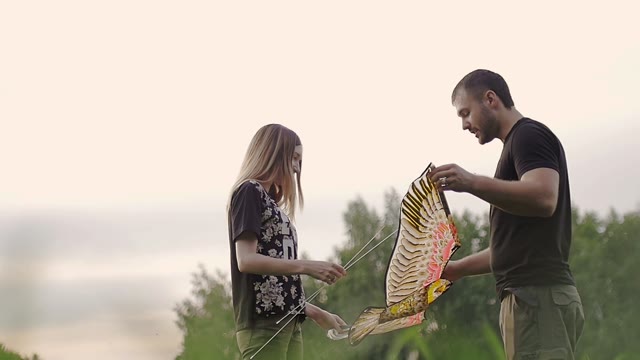 Young Couple Constructed A Kite