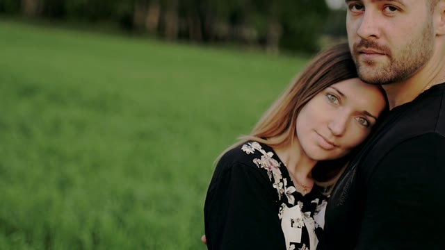 Guy With A Girl Looking At The Camera